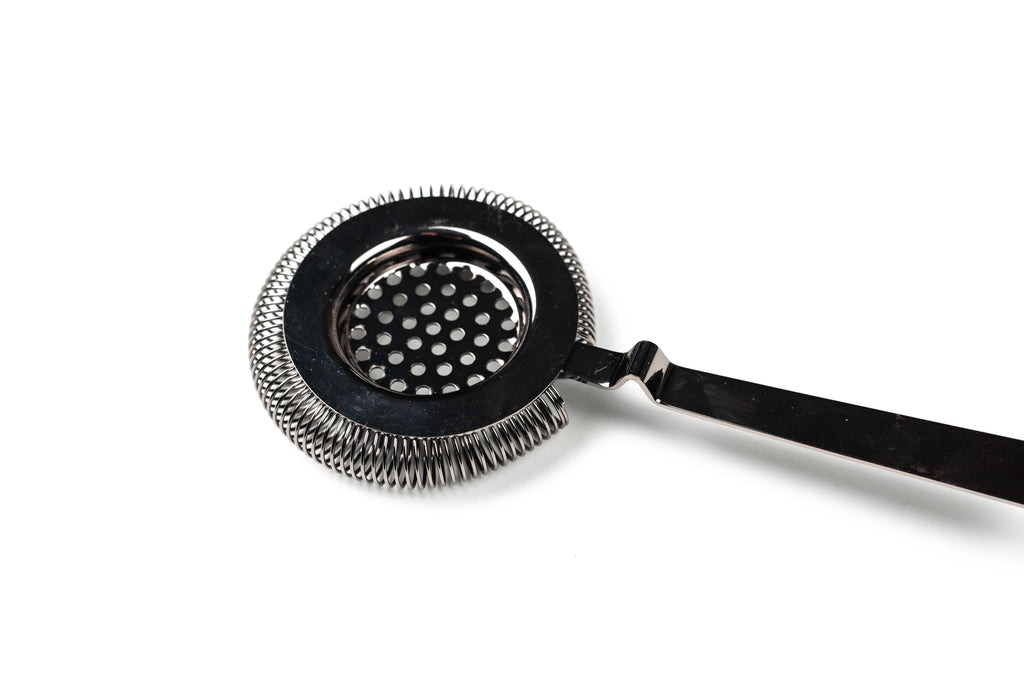 Metallic cocktail strainer on a white background